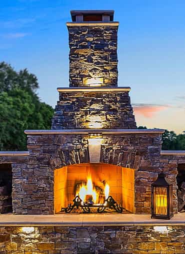 Custom outdoor living space with a fireplace