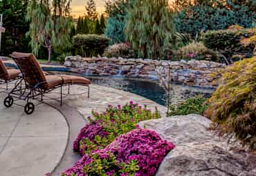 Natural custom pool with unique landscaping